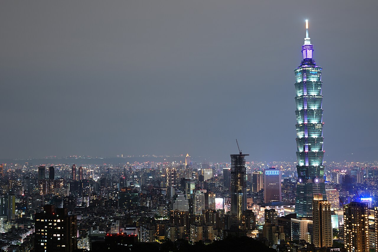 Taipei 101 and the Taipei city skyline lit up at night, viewed from Elephant Mountain